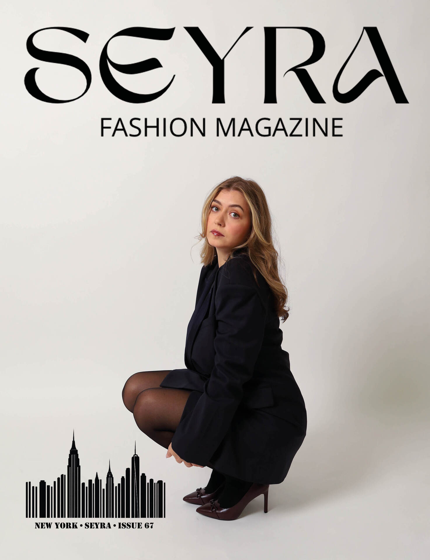 Juste crouching in a black blazer, SEYRA Fashion Magazine issue 67